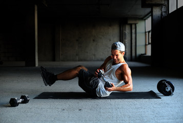 Athlete is engaged in crossfit in brutal gym