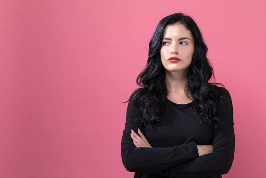 Portrait Of A Young Woman On A Solid Background