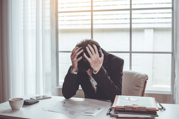 Business man unhappy in their work. Despair failed to work.