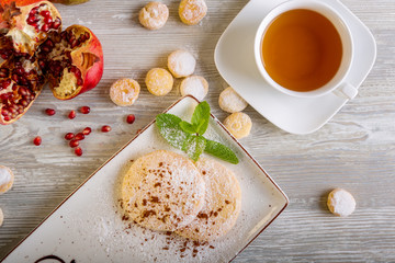 Close up view of beautiful elegant sweet dessert, shortbread, served on the plate. Beautiful decoration, restaurant dish, ready to eat. Tea time, cozy atmosphere.