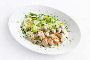 turkey stew garnished with marrow fettucine and decorated with parsley