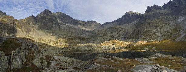 Panoramic view on mountain lake Prostredne Spisske pleso at the end of the hiking route to the Teryho Chata mountain shelter in the High Tatras in Slovakia
