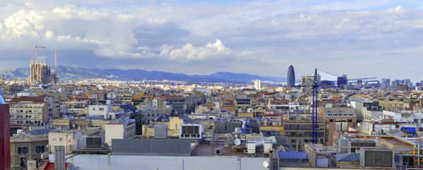 Fototapeta premium Rooftops and view of commercial and residential buildings in Barcelona Spain