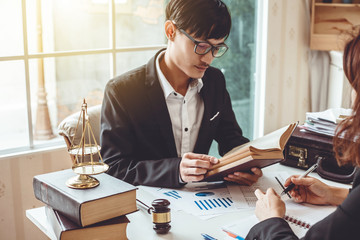 Lawyer working about legal legislation in courtroom to help their customer