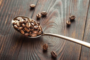Spoon of coffee beans