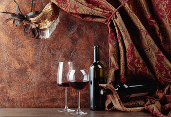 Red wine and carnival mask.