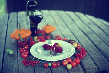 Thanksgiving day table settings with harvest pumpkins