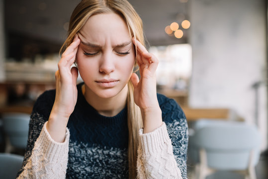 Headache. Young caucasian woman feel bad. Stressed. Depression. Female need medical pills, migraine - Powered by Adobe