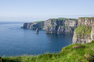 Landscape view of Cliffs of Moher with clear day sky. County Clare, Ireland.