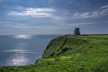 Fototapeta na wymiar Landscape view of Cliffs of Moher and O'brien's tower with clear day sky. County Clare, Ireland.