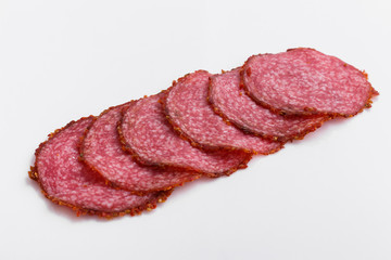 delicious sliced salami on a white background