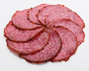delicious sliced salami on a white background