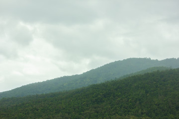 Landscape of sky and green mountain in rainy season at north Thailand.
