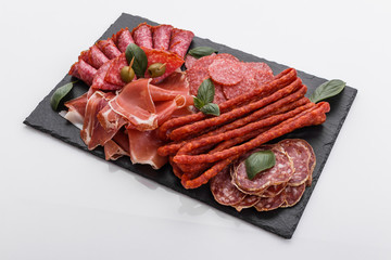 Cold smoked meat plate on a white background