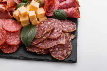 Cold smoked meat plate on a white background
