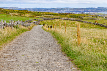 Fototapeta na wymiar Cliffs of Moher trail with Lahinch and Liscannor in background