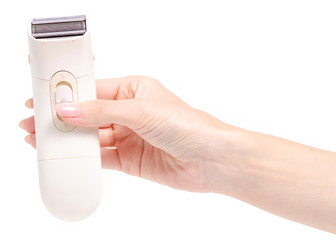 Female electric shaver in a hand on a white background isolation