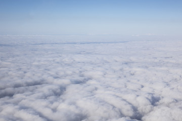 Could in the sky under tha airplane from the window of plane