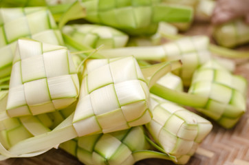 ketupat casing in bamboo container. traditional malay delicacy during Malaysian eid festival