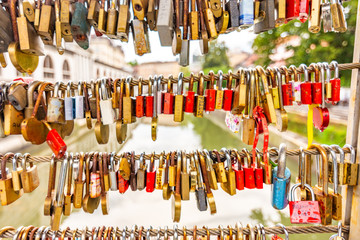 Bridge in Ljubljana city, with locks as symbol of love. Romantic tradition in Slovenia capital.