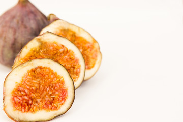 top view food, bright colorful figs fruits sliced isolated on white background. healthy vegetarian nutrition ingredients.