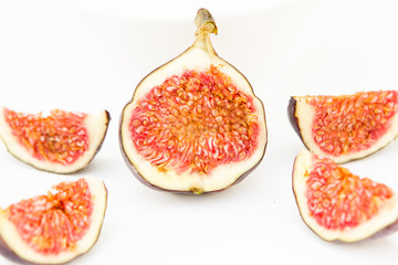 top view food. bright colorful ripe juicy figs fruits wallpaper isolated on white background.