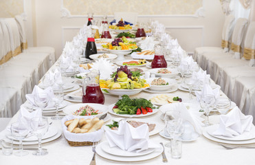 Served holiday table, cutlery, crockery, snacks