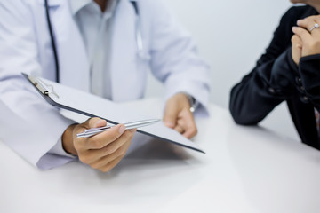 Fototapeta premium Doctor information and ask questions of illness of patients.