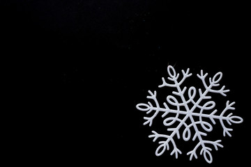White snowflakes isolated on black background. Winter theme. Christmas and New year decorations.