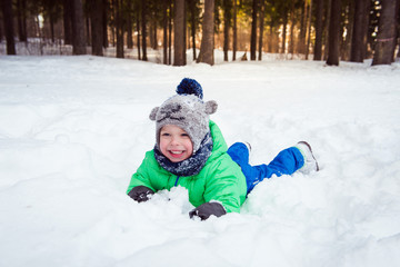 cute boy in winter forest