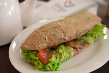 Sandwich with salmon and lettuce