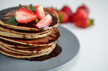 Pancakes with strawberry and chocolate