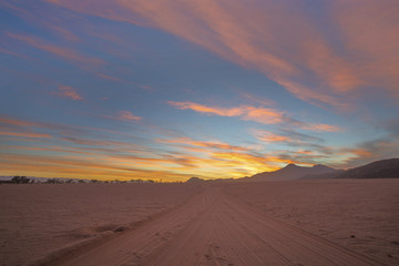 Pink and orange colored clouds at sunrise
