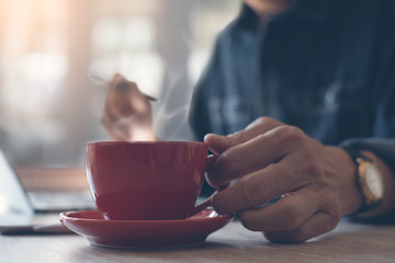 Man working and drinking coffee