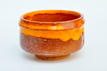 Orange traditional japanese pottery cup © Mykola Velychko