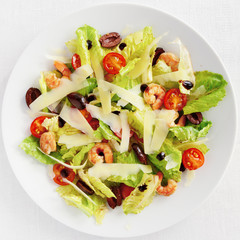 salad with romaine leafs, cherry tomatoes, fried in garlic oil shrimps, olives, and cheese dressed with olive oil, modena vinegar and cream