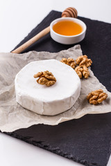 delicious creamy camembert cheese on a white background