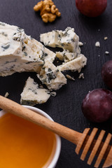 delicious blue cheese on wooden rustic background
