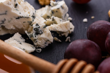delicious blue cheese on wooden rustic background