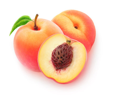 Isolated peaches. Three cut peach fruits isolated on white background with clipping path