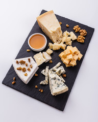 set of different cheeses on a wooden rustic background