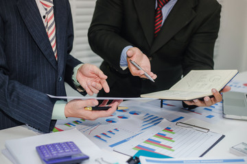 Two young businessman meeting to discuss about the investment and finance business.