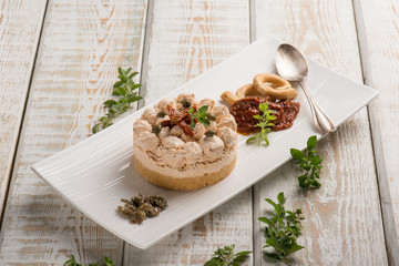 cheese cake with dried tomatoes capers and fresh oregano