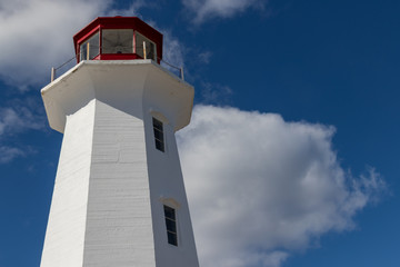 Peggy's Cove Lighthouse, summer sky clouds, blue sky.