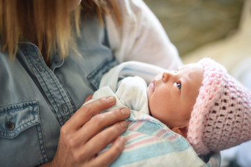 woman holding newborn baby