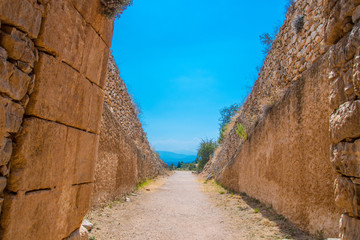 Coming out from the "Treasury of Atreus" or "Tomb of Agamemnon" of the citadel of of Mycenae. Archaeological site of Mycenae in Peloponnese Greece