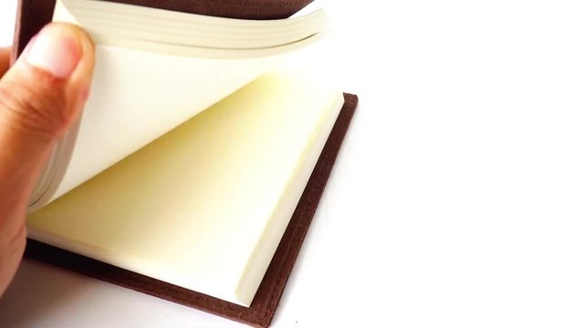 note book paper flip over page by page by hand  4K