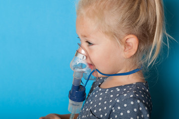 Bronchitis inhaler, respiratory problem. Caucasian child girl.
