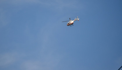 Flying helicopters in the sky.