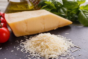 fragrant grated Parmesan on a slate stone slicing board